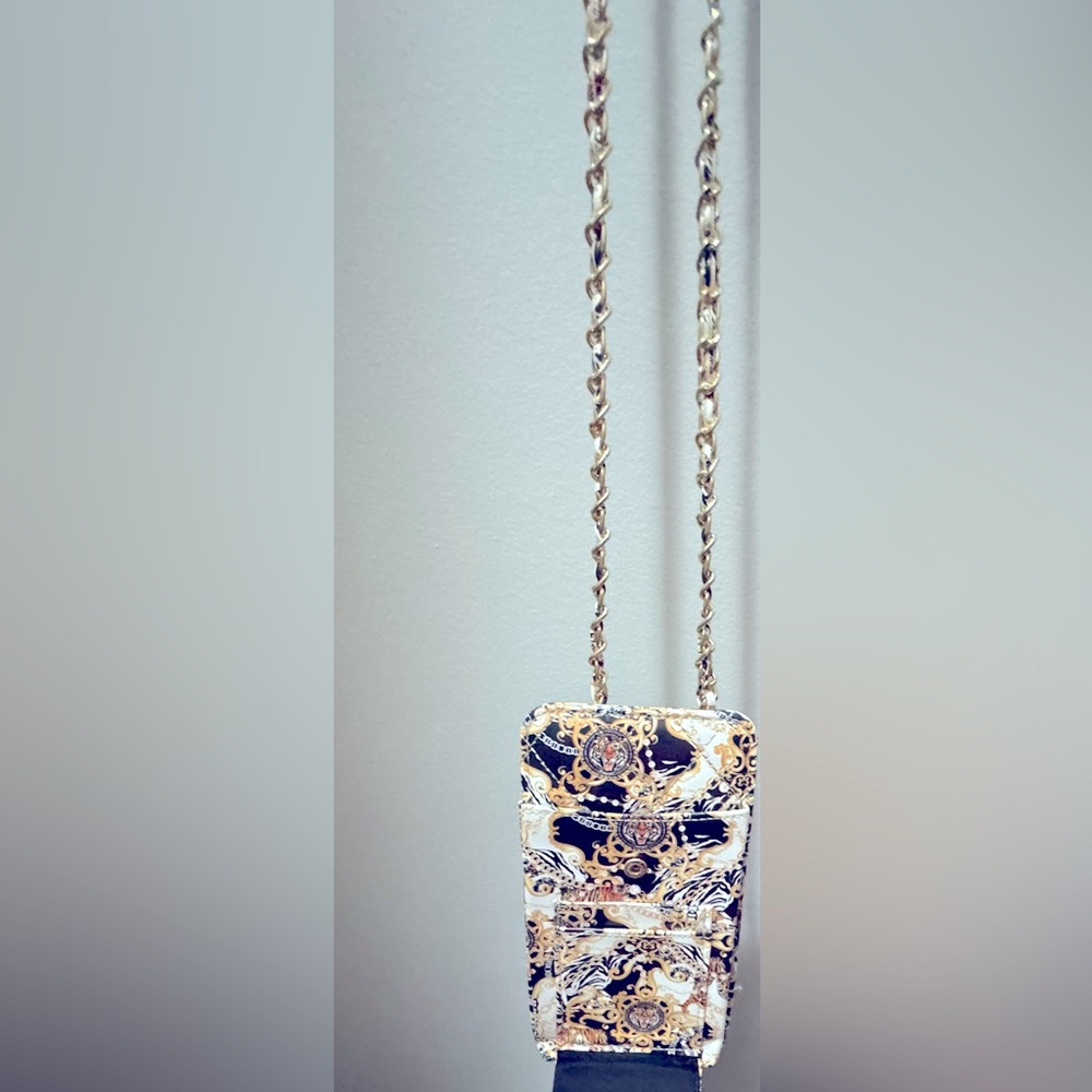 Just the cutest carrier for your phone, cards, and cash. Make me an offer!